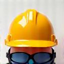 Hard hat and safety glasses on a construction site